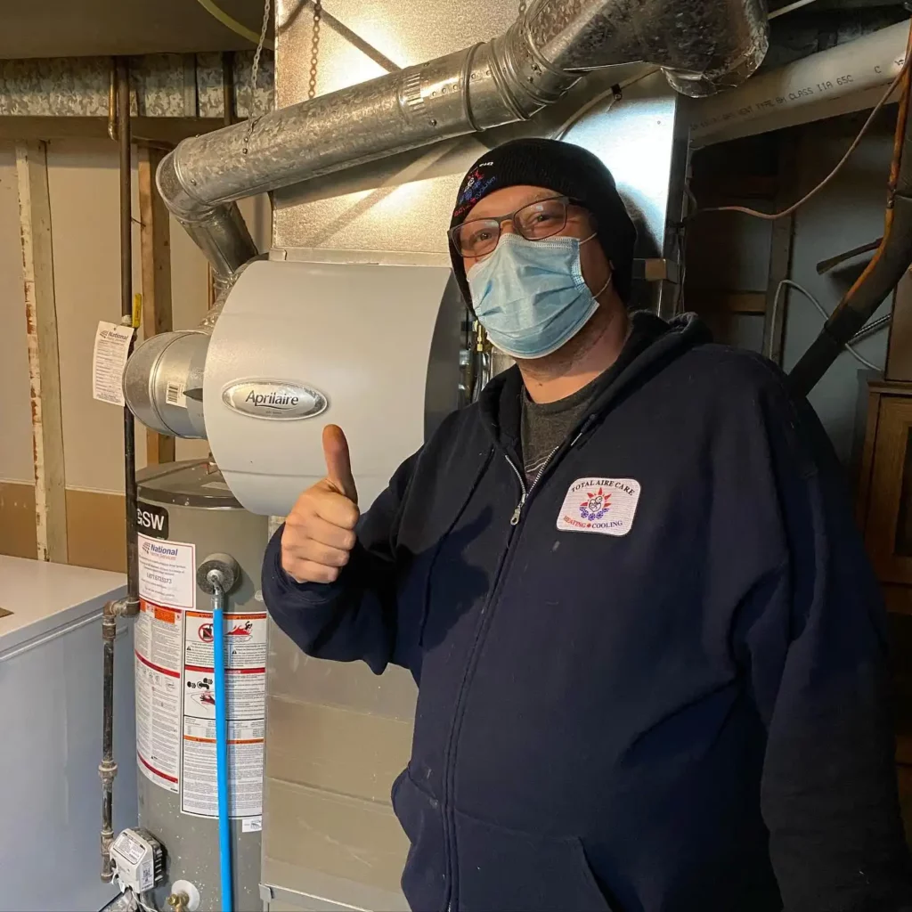 james from total aire care on a service call giving a thumbs up